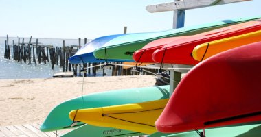 Beach and boardwalk with kayaks